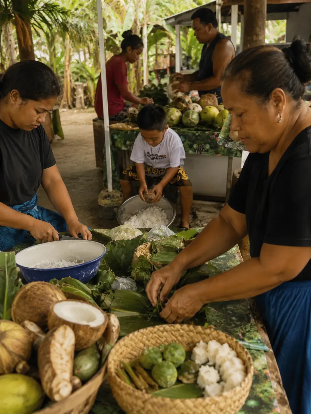 A Pacific family preparing food together at the market